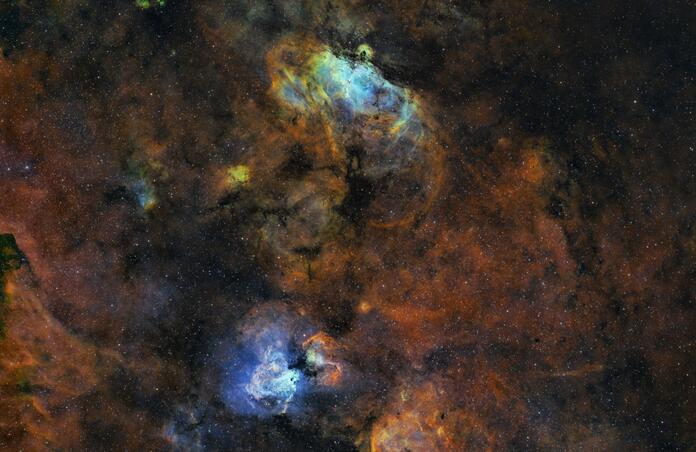 The Eagle and Omega Nebula in the Hubble Palette
