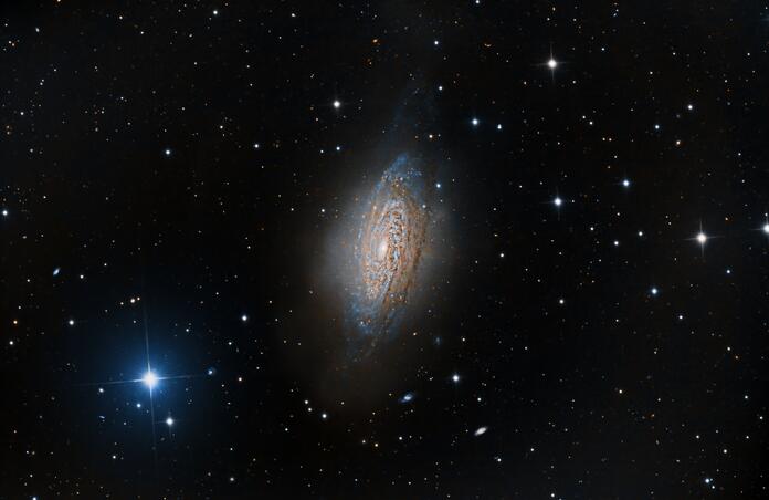 NGC3521 Spiral Galaxy and bright blue star HD96363.
