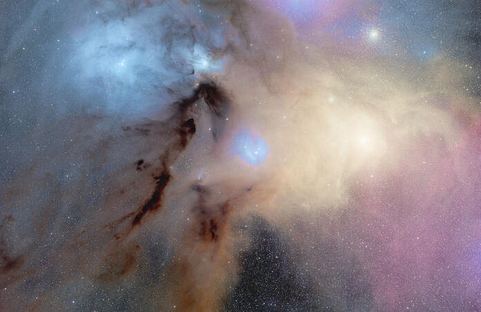 Rho Ophiuchi area with dust lanes, nebulae, and globular clusters.