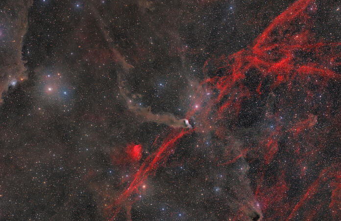 🌌 LDN 1217 – A Dark Cloud in a Cosmic Storm 🔴⚫✨