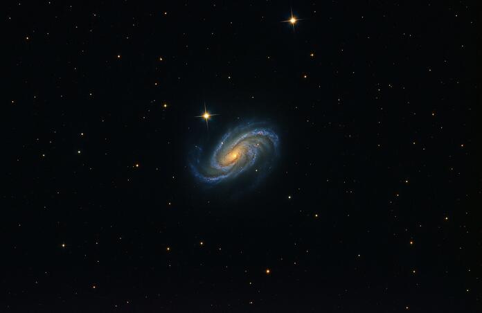 NGC613 Blue Galaxy Spinning in Space