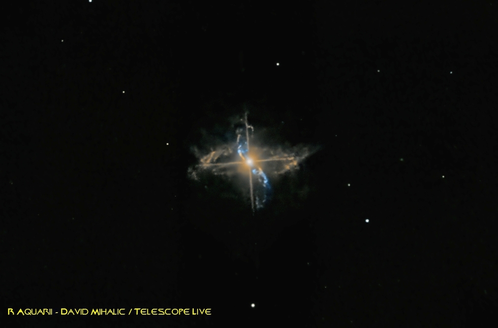 Reprocess: R Aquarii - A symbiotic double star composed of a Mira type variable red giant and a white dwarf. Material from the red giant is being pulled away by the white dwarf creating loops seen in the image.